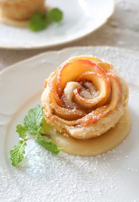 Apple Blossoms baked in a buttery pastry and drenched in rum caramel sauce
